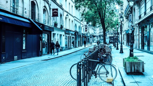 city sidewalk with bikes