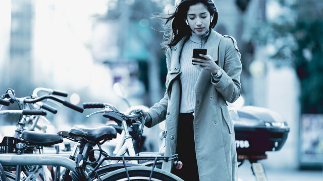 Woman on phone in city